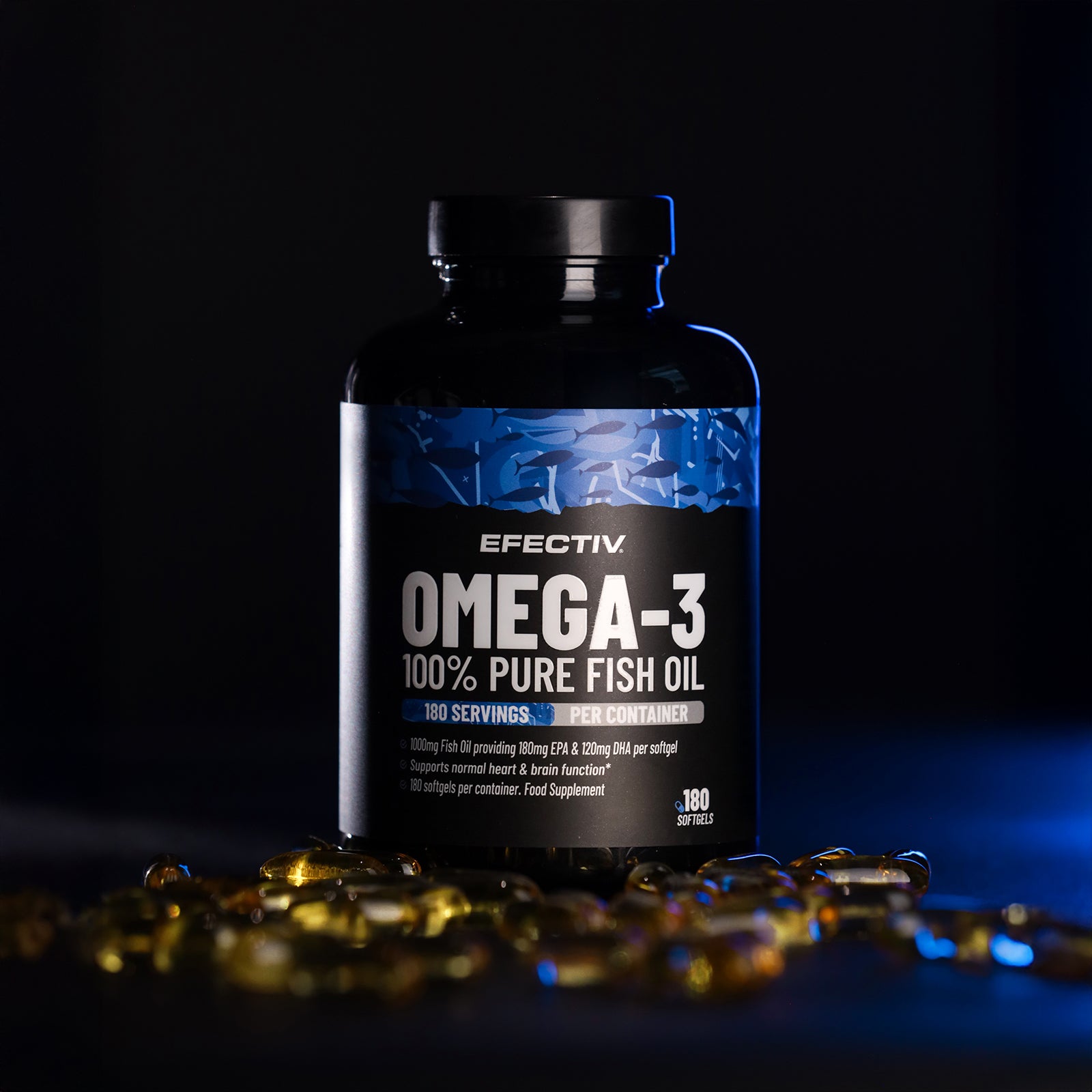 A bottle of EFECTIV Omega-3 supplements with text detailing the product name and benefits on the label, placed on a dark background with capsules scattered around.